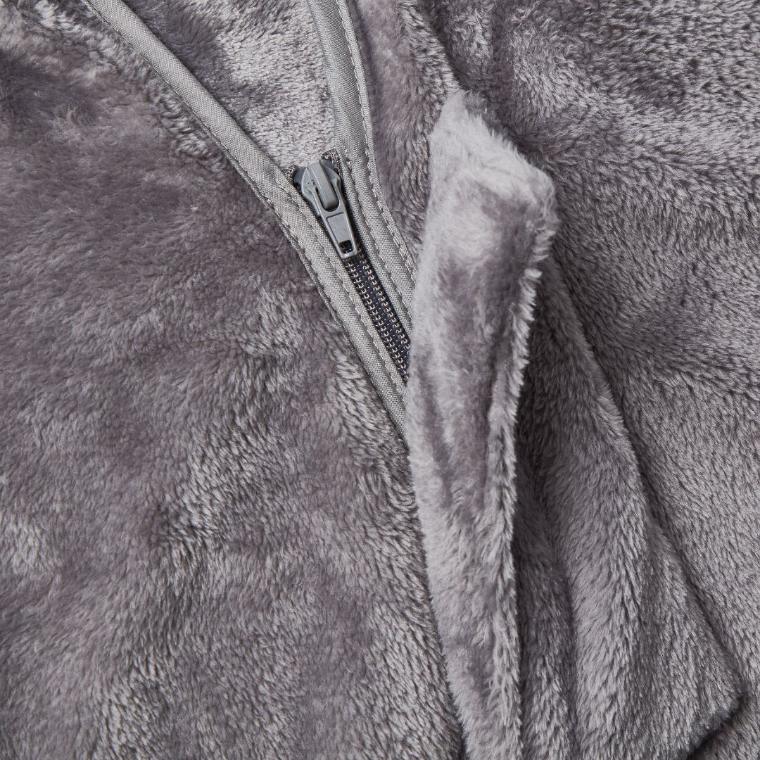Close-up of the Snhug Sit sitting blanket in grey fleece, highlighting the secure side zipper for easy on-and-off seated use.