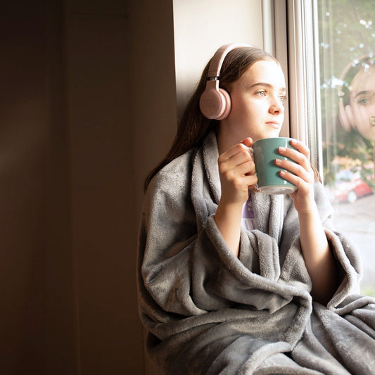 Sitting blanket providing warmth while seated at home with hands free